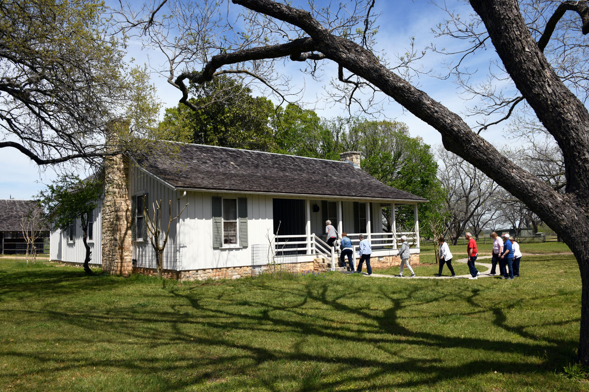 206 Fun Club travelers visited the LBJ re-created birth home.JPG